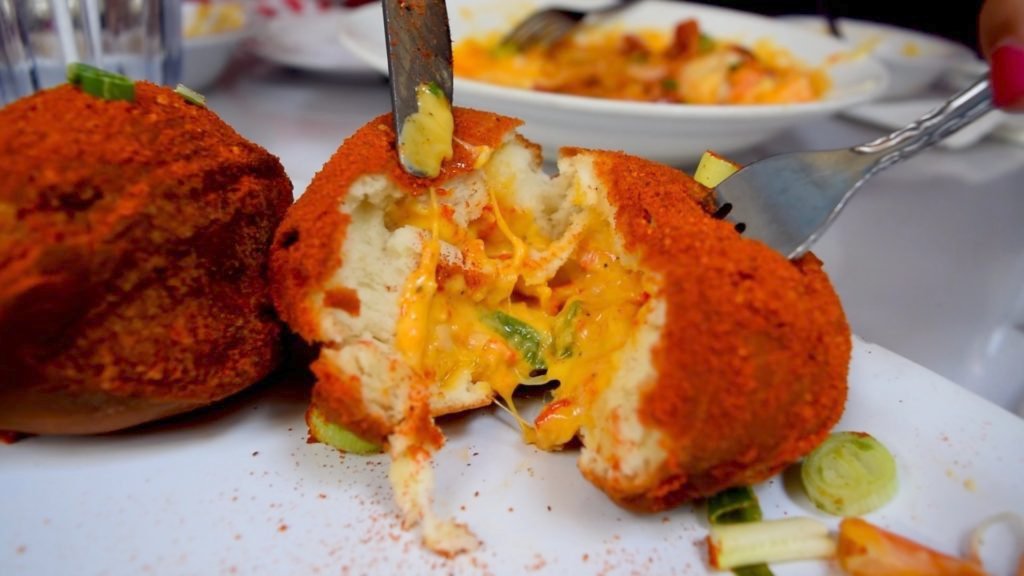 Beignets are mostly known as fried dough with powdered sugar, but these savory morsels are filled with crawfish