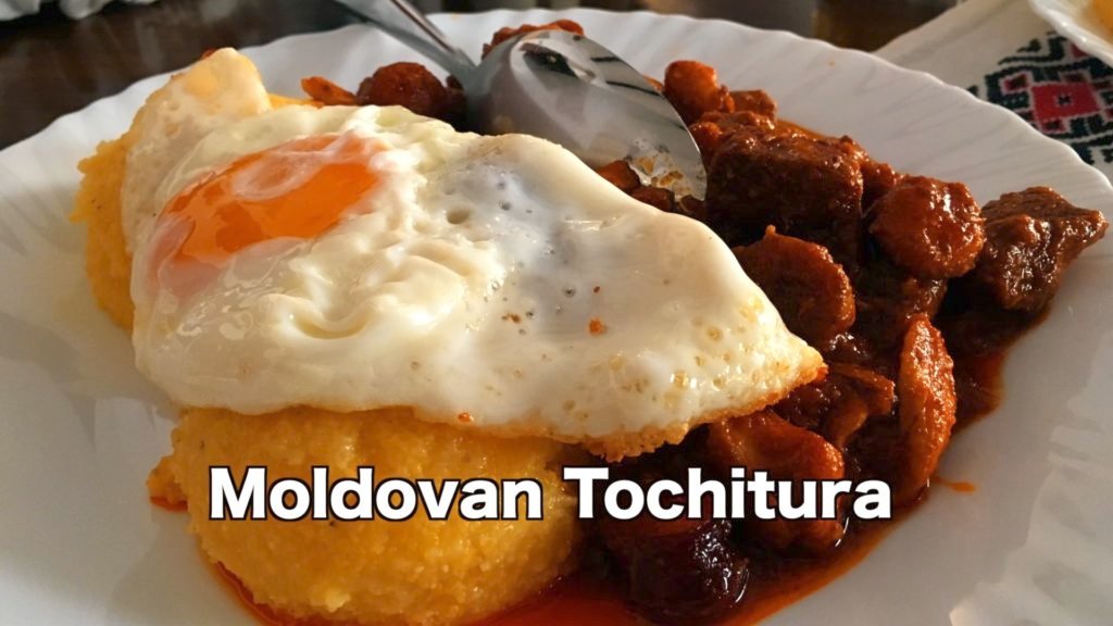 tochitura is a beef and pork stew served with polenta, sheep's cheese, and sometimes a fried egg